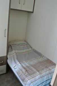 Ένα ή περισσότερα κρεβάτια σε δωμάτιο στο St Andrews Holiday Home