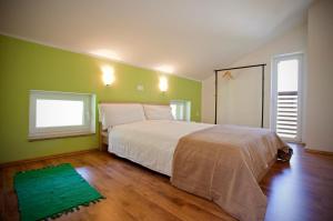 Postel nebo postele na pokoji v ubytování Apartments Soča