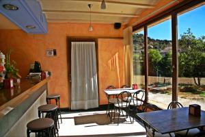 a patio with a table and chairs on a patio at Hostal La Fuente in Buera