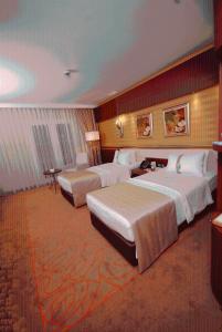 A bed or beds in a room at Holiday Inn Ankara-Kavaklidere by IHG
