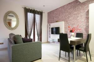 TV a/nebo společenská místnost v ubytování Aparthotel Rambla108