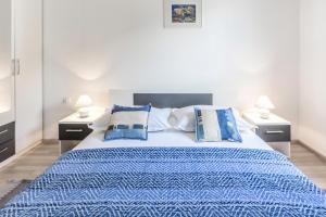 Postel nebo postele na pokoji v ubytování Apartments Perla