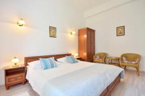 Postel nebo postele na pokoji v ubytování Apartments Perla