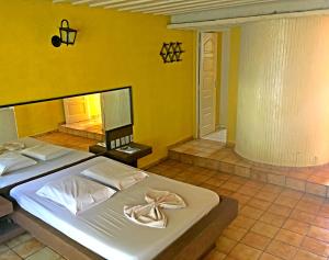 En eller flere senger på et rom på Hotel Comodoro de Rosário Do Sul
