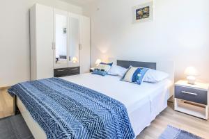 Postel nebo postele na pokoji v ubytování Apartments Perla