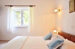Postel nebo postele na pokoji v ubytování Apartments Perla
