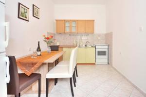 Kuchyň nebo kuchyňský kout v ubytování Apartments Perla