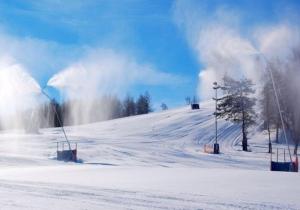 a snow covered ski slope with snow and steam at Zielony Domek Wisłoczek in Rymanów