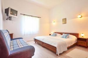 Postel nebo postele na pokoji v ubytování Apartments Perla