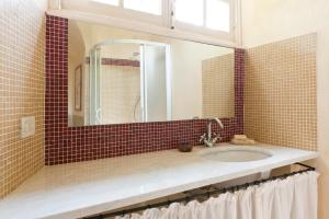 a bathroom with a sink and a mirror at Castello di Rocca Grimalda in Rocca Grimalda +32 photos