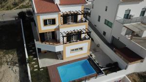 an aerial view of a house with a swimming pool at Alentejo`s Nest in Alcácer do Sal