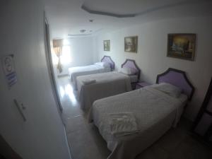 Postel nebo postele na pokoji v ubytování Backpacker Inn