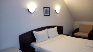 Postel nebo postele na pokoji v ubytování Hotel Enchevi