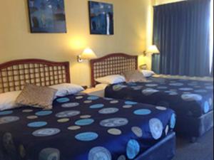 Postel nebo postele na pokoji v ubytování Raceways Motel
