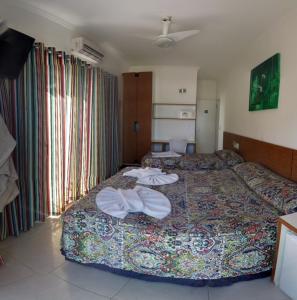 Cama ou camas em um quarto em Juquei Frente ao Mar Hotel Pousada