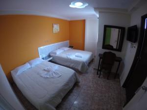 Postel nebo postele na pokoji v ubytování Hotel Villa del Mar