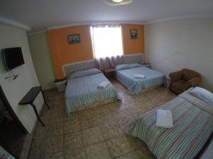 Postel nebo postele na pokoji v ubytování Hotel Villa del Mar