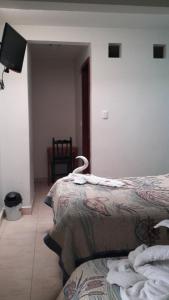 Postel nebo postele na pokoji v ubytování Hotel Real Colonial