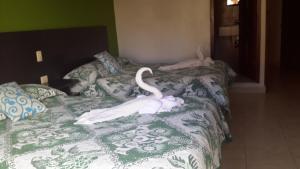 Postel nebo postele na pokoji v ubytování Hotel Real Colonial