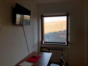 TV a/nebo společenská místnost v ubytování B&b L' Arancio in fiore