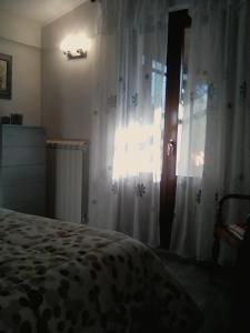 A bed or beds in a room at La Graziosa Dépendance