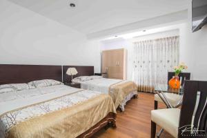 Tempat tidur dalam kamar di Hotel Costa Andina