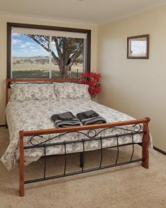 Ένα ή περισσότερα κρεβάτια σε δωμάτιο στο Wantana Cottage Farmstay