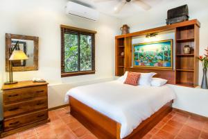 Ένα ή περισσότερα κρεβάτια σε δωμάτιο στο Hotel Villas Nicolas - Adults Only