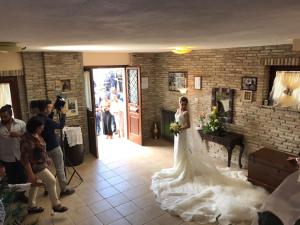 a woman in a wedding dress in a room at Casa Vacanze Il Castello in Pescina
