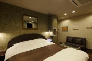 Postel nebo postele na pokoji v ubytování Hotel Waltz Okazaki (Adult Only)