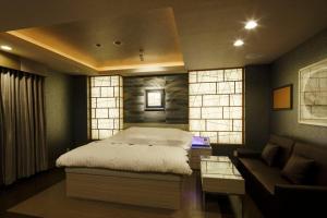Postel nebo postele na pokoji v ubytování Hotel Waltz Okazaki (Adult Only)
