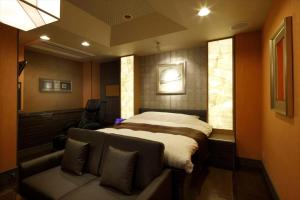 Postel nebo postele na pokoji v ubytování Hotel Waltz Okazaki (Adult Only)