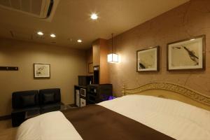 Postel nebo postele na pokoji v ubytování Hotel Waltz Okazaki (Adult Only)