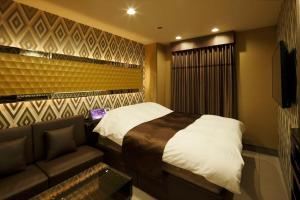 Postel nebo postele na pokoji v ubytování Hotel Waltz Okazaki (Adult Only)