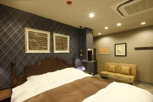 Postel nebo postele na pokoji v ubytování Hotel Waltz Okazaki (Adult Only)