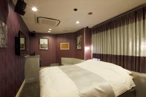 Postel nebo postele na pokoji v ubytování Hotel Waltz Okazaki (Adult Only)
