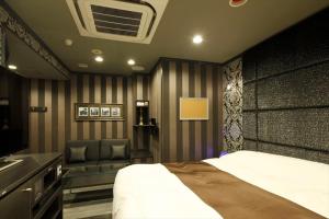 Postel nebo postele na pokoji v ubytování Hotel Waltz Okazaki (Adult Only)