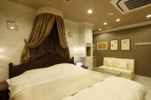 Postel nebo postele na pokoji v ubytování Hotel Waltz Okazaki (Adult Only)