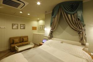 Postel nebo postele na pokoji v ubytování Hotel Waltz Okazaki (Adult Only)