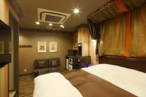 Postel nebo postele na pokoji v ubytování Hotel Waltz Okazaki (Adult Only)