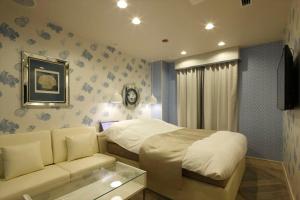 Postel nebo postele na pokoji v ubytování Hotel Waltz Okazaki (Adult Only)