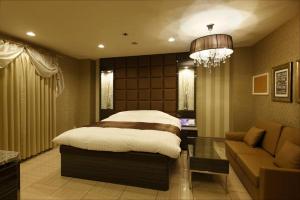 Postel nebo postele na pokoji v ubytování Hotel Waltz Okazaki (Adult Only)