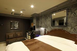 Postel nebo postele na pokoji v ubytování Hotel Waltz Okazaki (Adult Only)