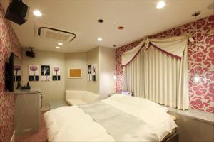 Postel nebo postele na pokoji v ubytování Hotel Waltz Okazaki (Adult Only)
