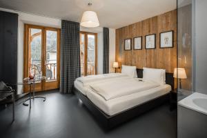 Letto o letti in una camera di Pensiun Aldier