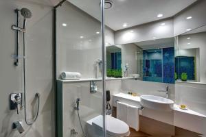 a bathroom with a toilet and a sink and a shower at Al Khoory Inn Bur Dubai in Dubai