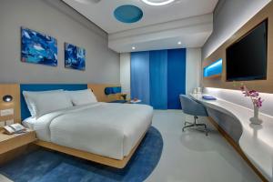 a bedroom with a bed and a desk and a tv at Al Khoory Inn Bur Dubai in Dubai +18 photos