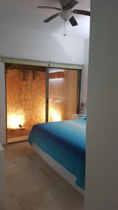 Postel nebo postele na pokoji v ubytování Quetzal Apartment + 37 fotografií