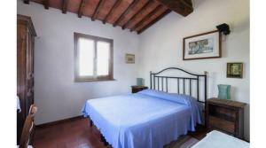 Postel nebo postele na pokoji v ubytování Camere e Appartamenti Baldini Romanita