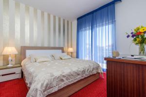 Postel nebo postele na pokoji v ubytování Villa Mediterana